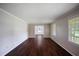 Open living room with hardwood floors and large windows, perfect for entertaining at 3802 Birchbriar Ct, Decatur, GA 30034