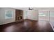 Living room features a brick fireplace, hardwood floors, natural light and access to other rooms at 3802 Birchbriar Ct, Decatur, GA 30034