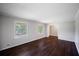 Living room featuring hardwood floors, natural light, and neutral paint at 3802 Birchbriar Ct, Decatur, GA 30034