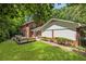 A lush backyard features raised garden beds and a large patio at 4243 Mcclatchey Ne Cir, Atlanta, GA 30342