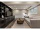 Relaxing finished basement featuring large sectional, entertainment center, and lots of space at 4243 Mcclatchey Ne Cir, Atlanta, GA 30342