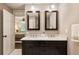 Bathroom with double vanity, marble countertop, and wooden cabinetry near the main bedroom at 4243 Mcclatchey Ne Cir, Atlanta, GA 30342