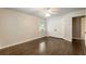 Bedroom featuring hardwood floors, a ceiling fan, and a closet with double doors at 4243 Mcclatchey Ne Cir, Atlanta, GA 30342