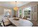 Dining room with hardwood floors, natural light, view to kitchen at 4243 Mcclatchey Ne Cir, Atlanta, GA 30342