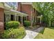 Brick home with manicured landscaping, a stone walkway, and covered front entry at 4243 Mcclatchey Ne Cir, Atlanta, GA 30342