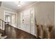 Inviting foyer with hardwood floors, a classic front door and stylish decor at 4243 Mcclatchey Ne Cir, Atlanta, GA 30342
