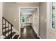 Foyer featuring hardwood floors, staircase, and view to the living room at 4243 Mcclatchey Ne Cir, Atlanta, GA 30342