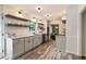 Kitchen features white cabinets, open shelving, and stainless steel appliances at 4243 Mcclatchey Ne Cir, Atlanta, GA 30342