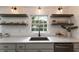Charming kitchen featuring white countertops, floating shelves, and a window view at 4243 Mcclatchey Ne Cir, Atlanta, GA 30342
