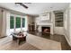Inviting living room with a fireplace, hardwood floors, and French doors to the patio at 4243 Mcclatchey Ne Cir, Atlanta, GA 30342