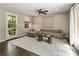 Bright living room with hardwood floors, stylish furniture, and a walkout to the backyard at 4243 Mcclatchey Ne Cir, Atlanta, GA 30342