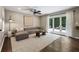 Spacious living room with hardwood floors, a ceiling fan, and access to outdoor living space at 4243 Mcclatchey Ne Cir, Atlanta, GA 30342