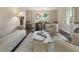 Inviting living room showcasing dining area with contemporary furnishings and bright lighting at 4243 Mcclatchey Ne Cir, Atlanta, GA 30342