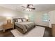 Bright main bedroom with hardwood floors, ceiling fan, and large windows for natural light at 4243 Mcclatchey Ne Cir, Atlanta, GA 30342
