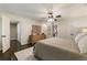 Spacious main bedroom with hardwood floors, ceiling fan, and decorative wooden dresser at 4243 Mcclatchey Ne Cir, Atlanta, GA 30342