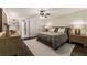 Well-lit main bedroom with hardwood floors, built-in shelving and a view of the bathroom at 4243 Mcclatchey Ne Cir, Atlanta, GA 30342