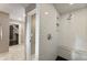 Walk-in shower with white subway tile, bench seating, and an open view into the closet at 4243 Mcclatchey Ne Cir, Atlanta, GA 30342