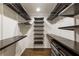 Walk-in closet with custom shelving, drawers, and ample storage space for clothing and accessories at 4243 Mcclatchey Ne Cir, Atlanta, GA 30342