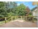 Gorgeous outdoor deck with wooden railings, ideal for entertaining and relaxing at 106 Waterford Place Pl, Acworth, GA 30101