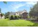 Expansive backyard with lush green lawn and mature trees for privacy and shade at 106 Waterford Place Pl, Acworth, GA 30101