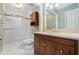 Modern bathroom showcasing dark wood cabinetry, granite counters, and a tiled shower at 106 Waterford Place Pl, Acworth, GA 30101