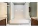 Bright bathroom with a white tiled bath and shower, and stylish fixtures at 106 Waterford Place Pl, Acworth, GA 30101