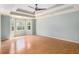 Spacious main bedroom has tray ceilings, neutral paint, and great natural light at 106 Waterford Place Pl, Acworth, GA 30101
