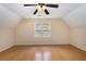 Spacious bonus room with hardwood floors, natural light, and pleasant neighborhood views at 106 Waterford Place Pl, Acworth, GA 30101