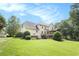 Beautiful exterior of the two-story home with well-manicured lawn and inviting backyard at 106 Waterford Place Pl, Acworth, GA 30101