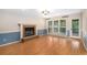 Inviting living room features a fireplace, hardwood floors, and access to an outdoor area at 106 Waterford Place Pl, Acworth, GA 30101