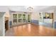 Open living space offering hardwood floors, fireplace, and seamless access to a well-lit kitchen at 106 Waterford Place Pl, Acworth, GA 30101