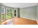 Sun-filled room with hardwood floors, crown molding, and beautiful bay windows with scenic views at 106 Waterford Place Pl, Acworth, GA 30101