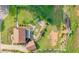Stunning aerial view of landscaped backyard with fire pit, pergola, and lush greenery at 110 Amsterdam Dr, Lilburn, GA 30047