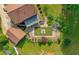 Aerial view of backyard with stone patio, outdoor seating, and a well-manicured lawn at 110 Amsterdam Dr, Lilburn, GA 30047