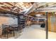 Unfinished basement space with concrete walls, exposed ceiling, and room for storage or customization at 110 Amsterdam Dr, Lilburn, GA 30047