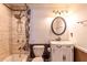 Cozy bathroom features a shower-tub combination with designer shower curtain and a classic single sink vanity at 110 Amsterdam Dr, Lilburn, GA 30047