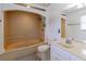 Traditional bathroom featuring a tub, shower, and white vanity at 110 Amsterdam Dr, Lilburn, GA 30047