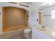 Well-maintained bathroom features a large soaking tub, ceramic tiling, and a single sink vanity at 110 Amsterdam Dr, Lilburn, GA 30047
