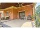 Inviting covered porch with seating, plants, and brick exterior at 110 Amsterdam Dr, Lilburn, GA 30047