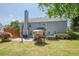 Large backyard with a spacious lawn, patio, hot tub, and privacy fence at 2304 Mitford Ct, Dacula, GA 30019