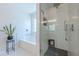 Bright bathroom with a glass enclosed shower, soaking tub, and sleek fixtures at 2304 Mitford Ct, Dacula, GA 30019