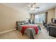 Comfortable bedroom with neutral walls and plush carpet provides a relaxing atmosphere at 2304 Mitford Ct, Dacula, GA 30019