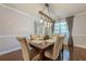 Cozy dining room featuring hardwood floors and modern lighting at 2304 Mitford Ct, Dacula, GA 30019