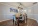 Elegant dining room with modern chandelier, hardwood floors, and stylish decor at 2304 Mitford Ct, Dacula, GA 30019
