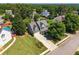 Traditional two-story home featuring a well-manicured lawn, mature trees, and a welcoming front porch at 2304 Mitford Ct, Dacula, GA 30019