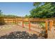 Enclosed garden area with raised garden beds and a wooden fence, perfect for gardening enthusiasts at 2304 Mitford Ct, Dacula, GA 30019