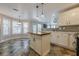 Spacious kitchen featuring a center island, tile floors, pendant lighting, and stainless steel appliances at 2304 Mitford Ct, Dacula, GA 30019