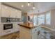 Well-equipped kitchen with stainless steel appliances and butcher block island at 2304 Mitford Ct, Dacula, GA 30019