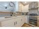 Modern kitchen showcasing stainless steel appliances, gray backsplash, and bright countertops at 2304 Mitford Ct, Dacula, GA 30019
