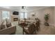 Comfortable living room with a stone fireplace and plenty of natural light at 2304 Mitford Ct, Dacula, GA 30019